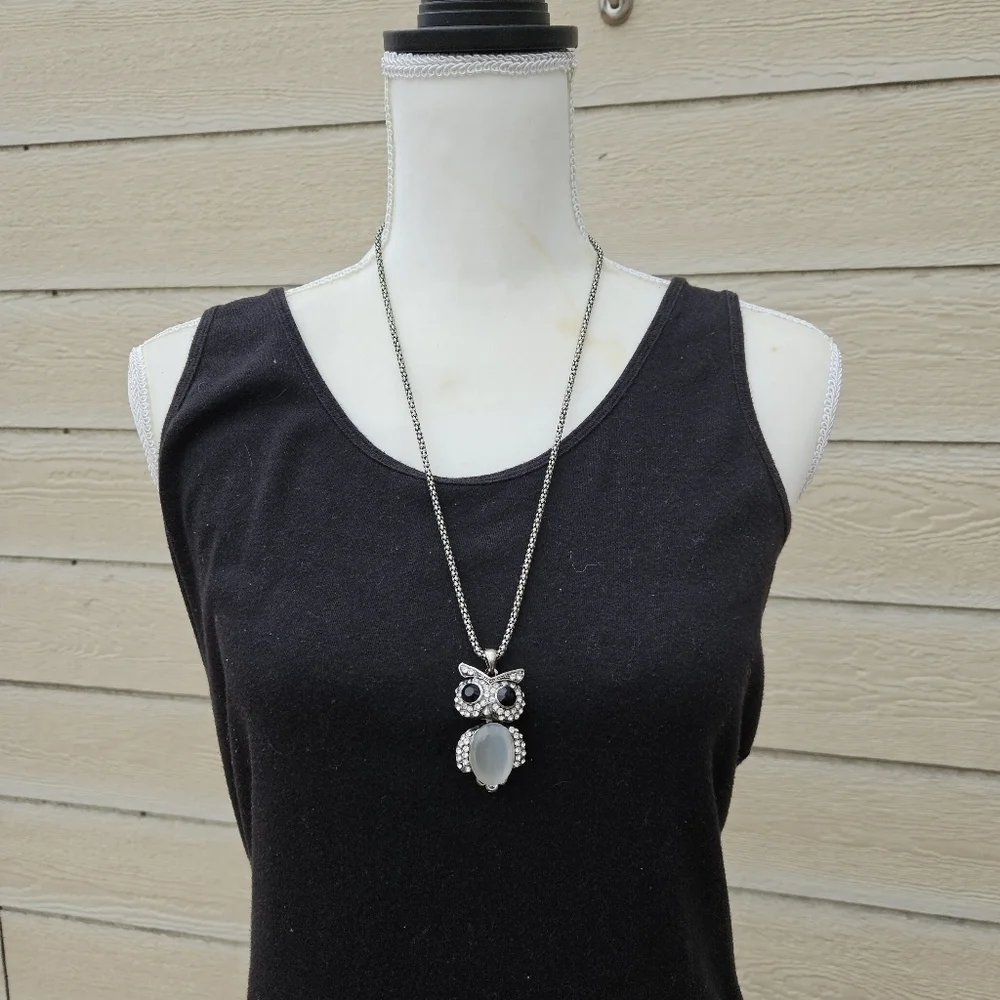 long silver tone chain necklace with articulated owl pendant